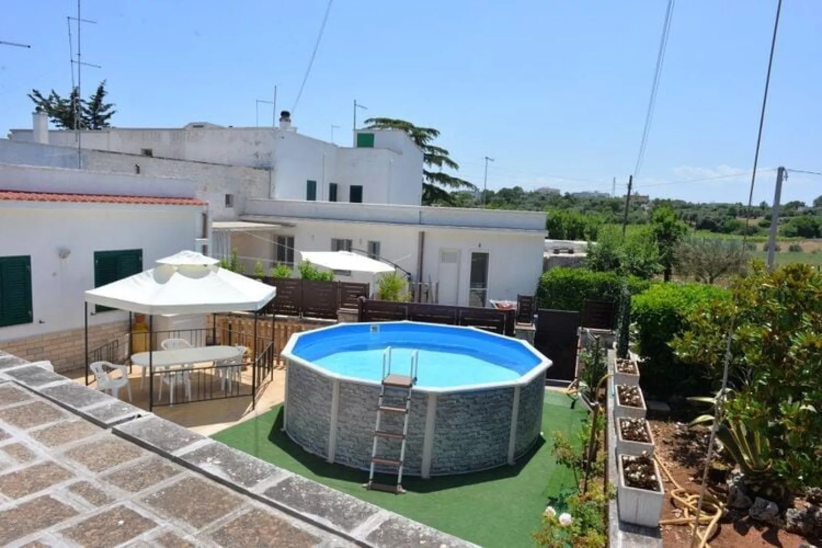 Trullo Cittadino Cisternino-Gardens summer