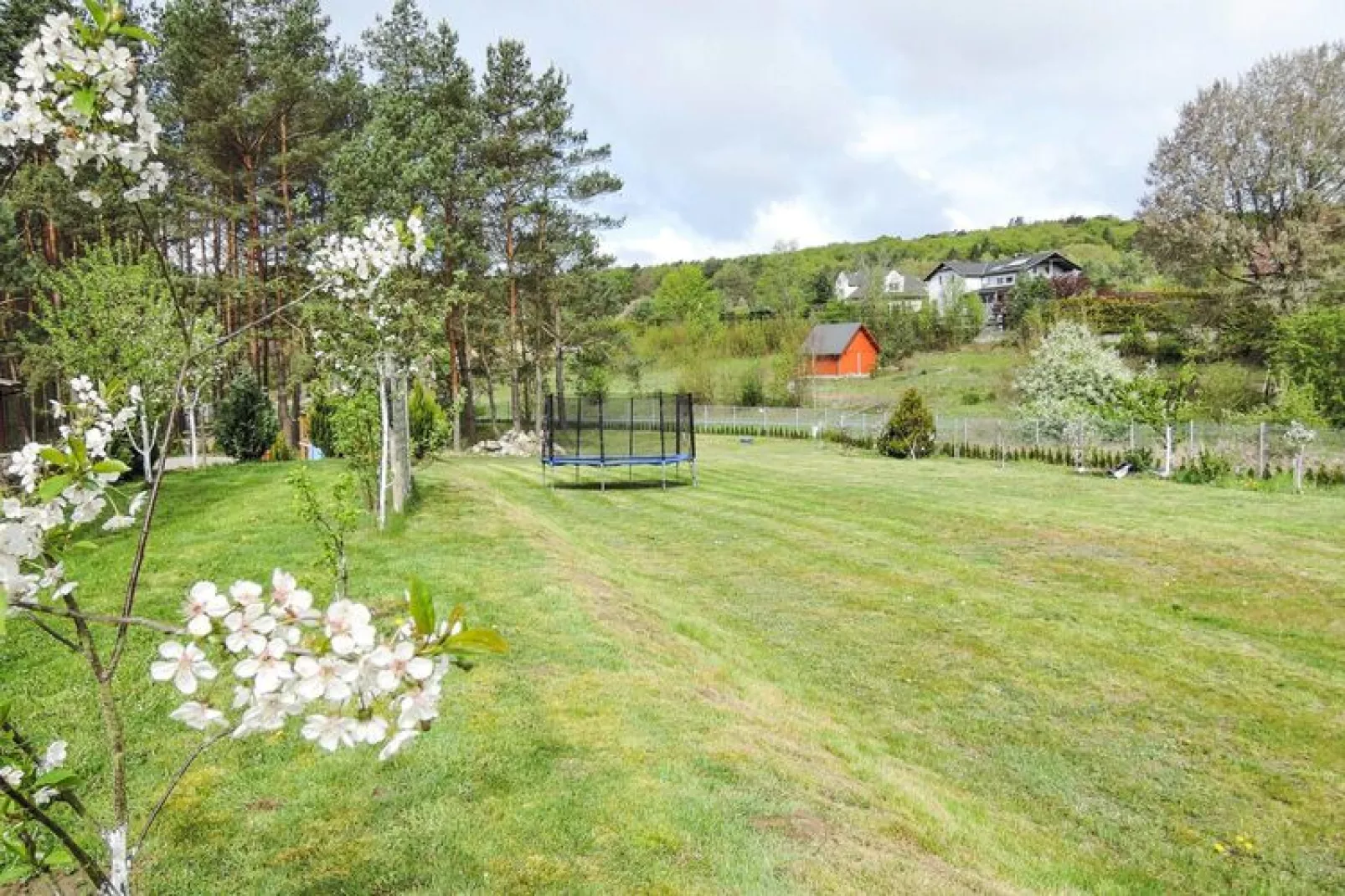 Holiday resort in Wiselka for 3 persons with carpark space-Gardens in summer