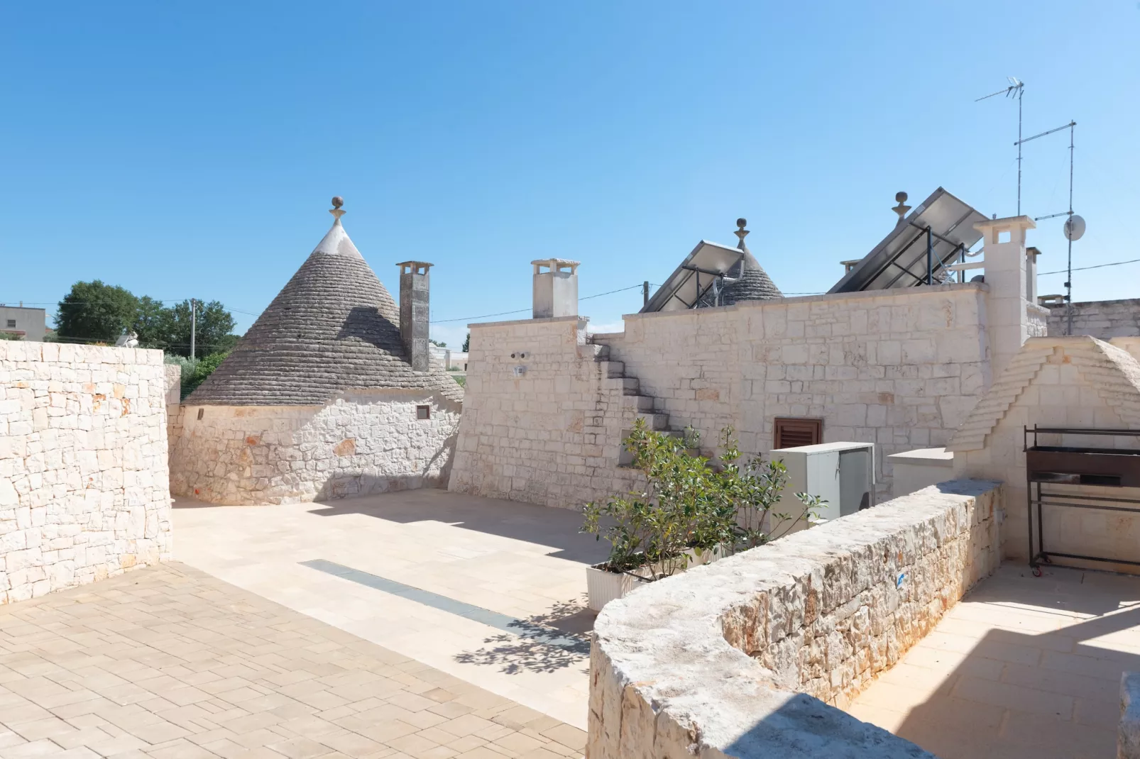 Trulli Cesare in Locorotondo-Gardens summer