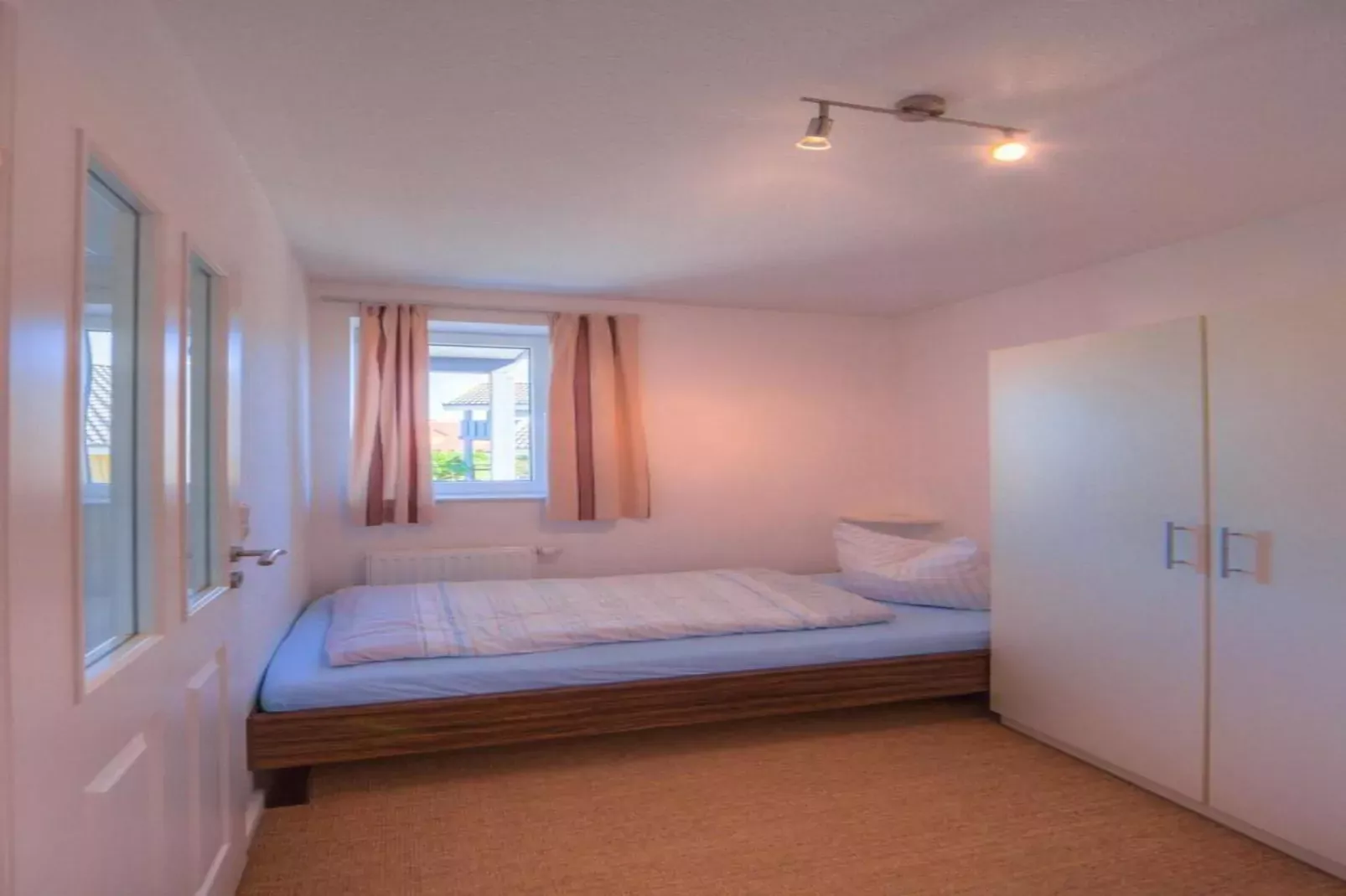 Kapitänshaus Gartendeck 64 qm Nr 412-Bedroom