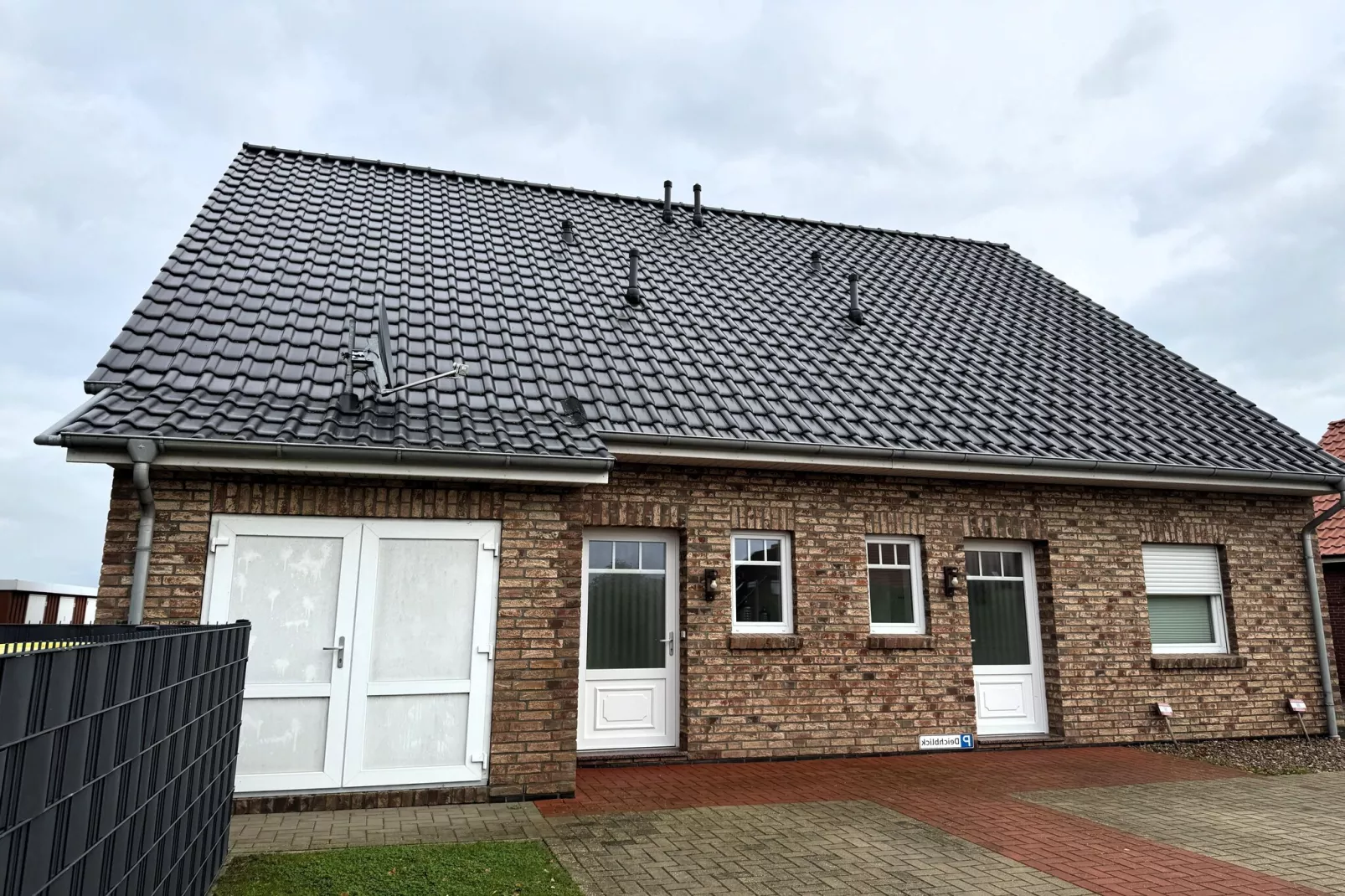Gemütliche Nordsee-Wohnung in Neßmersiel mit Garten und Feldblick-Exterior summer