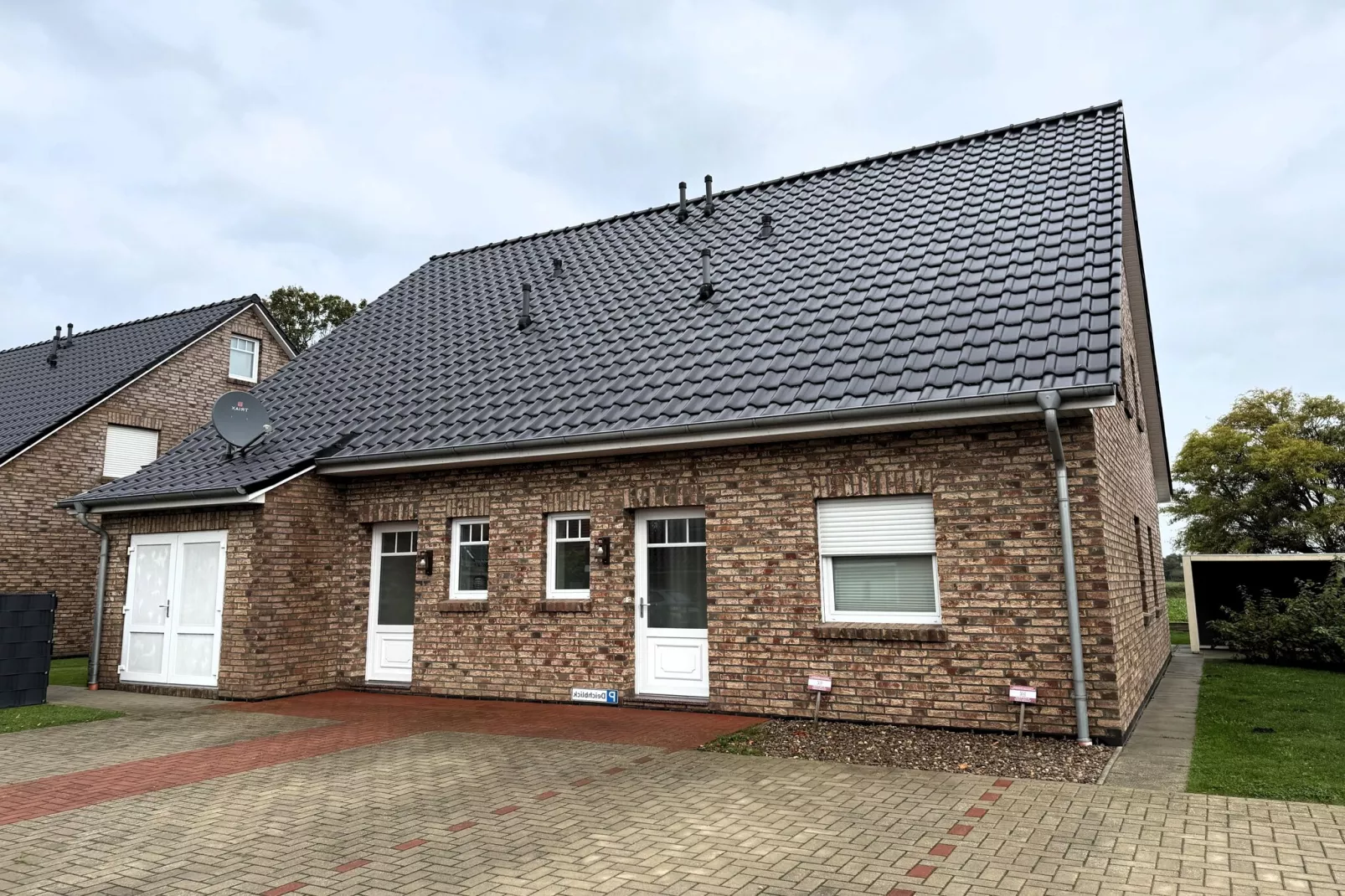Gemütliche Nordsee-Wohnung in Neßmersiel mit Garten und Feldblick-Exterior summer