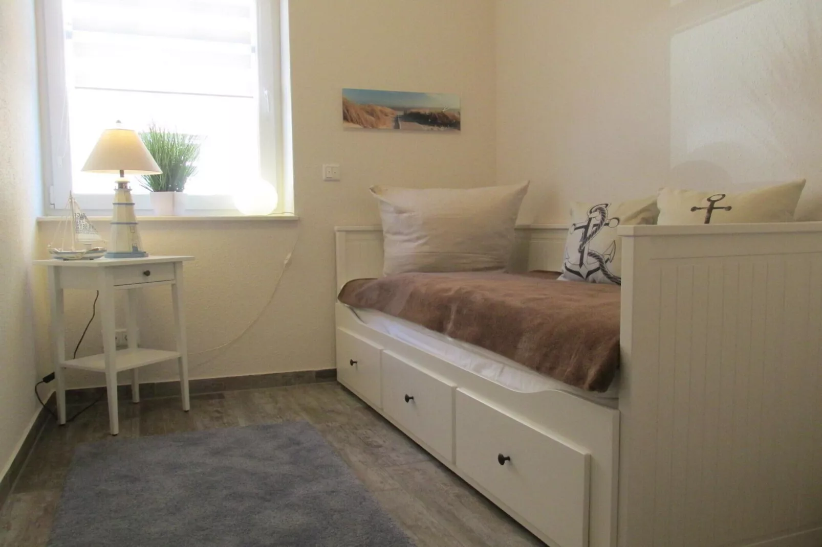 Gemütliche Nordsee-Wohnung in Neßmersiel mit Garten und Feldblick-Bedroom