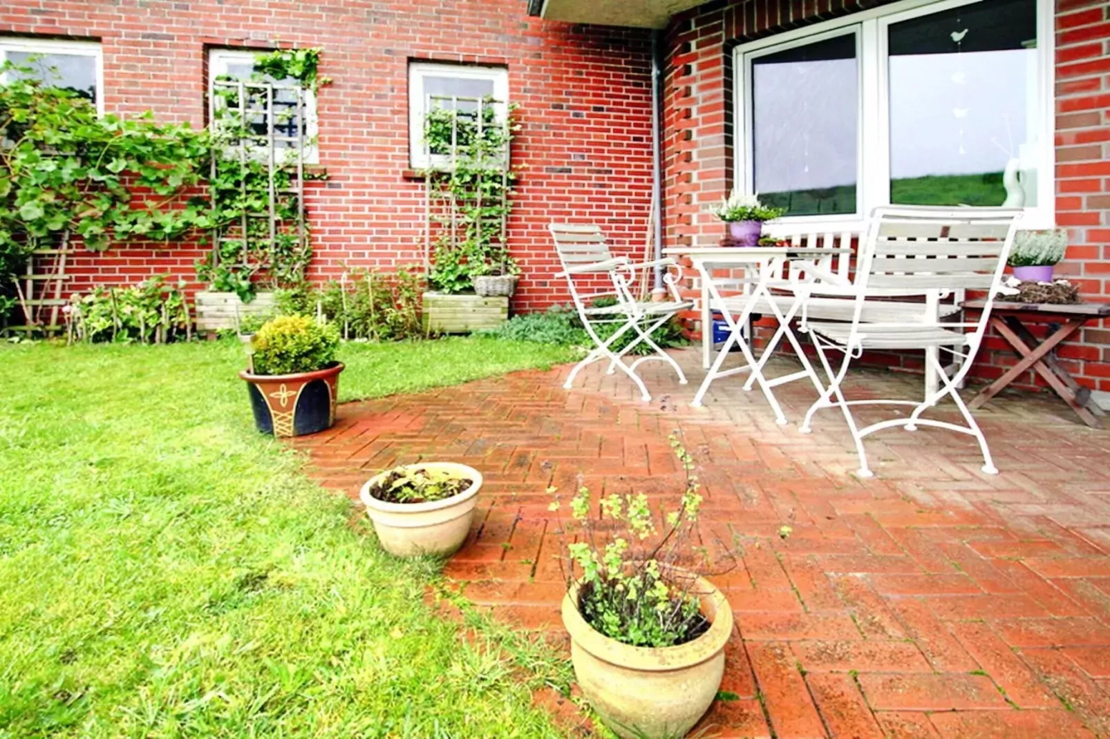 Ferienwohnung Kapitänskajüte-Gärten Sommer
