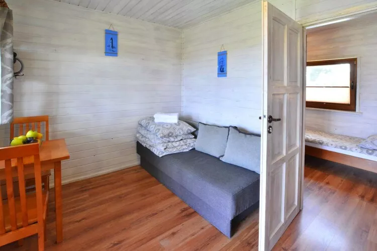 Parterowe domki wakacyjne dla max 2 osób w Bobolinie-Wohnzimmer