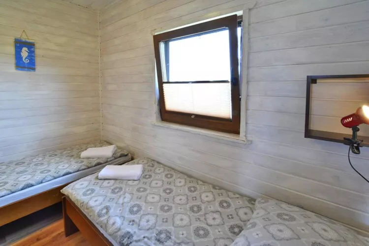 Parterowe domki wakacyjne dla max 2 osób w Bobolinie-Schlafzimmer