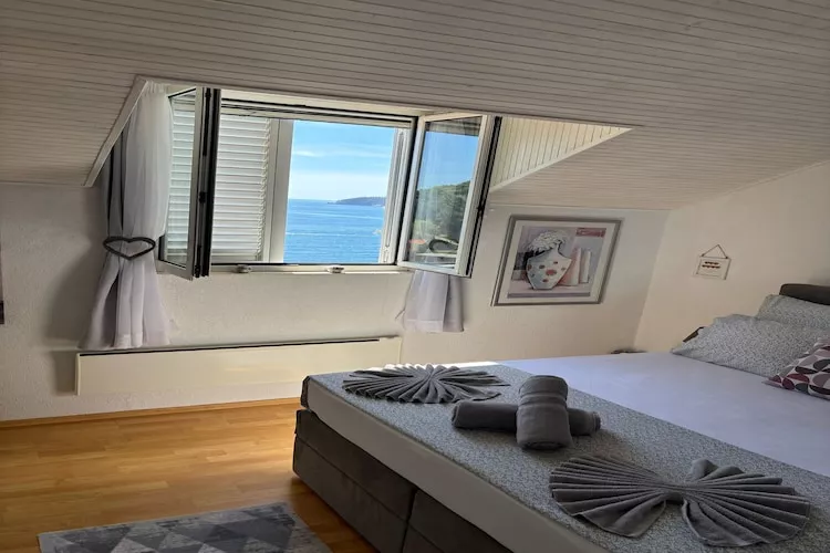 Indy's Beach Apartments -Two Bedroom Apartment with Balcony and Sea View-Bedroom