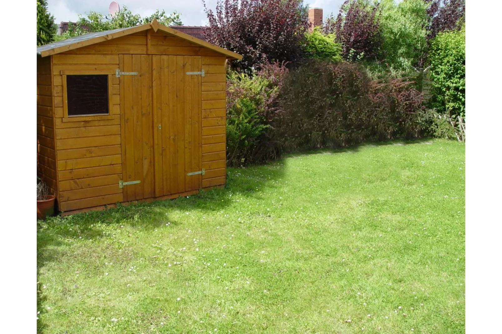 Ferienbungalow Arielle in Dornumersiel-Gardens in summer