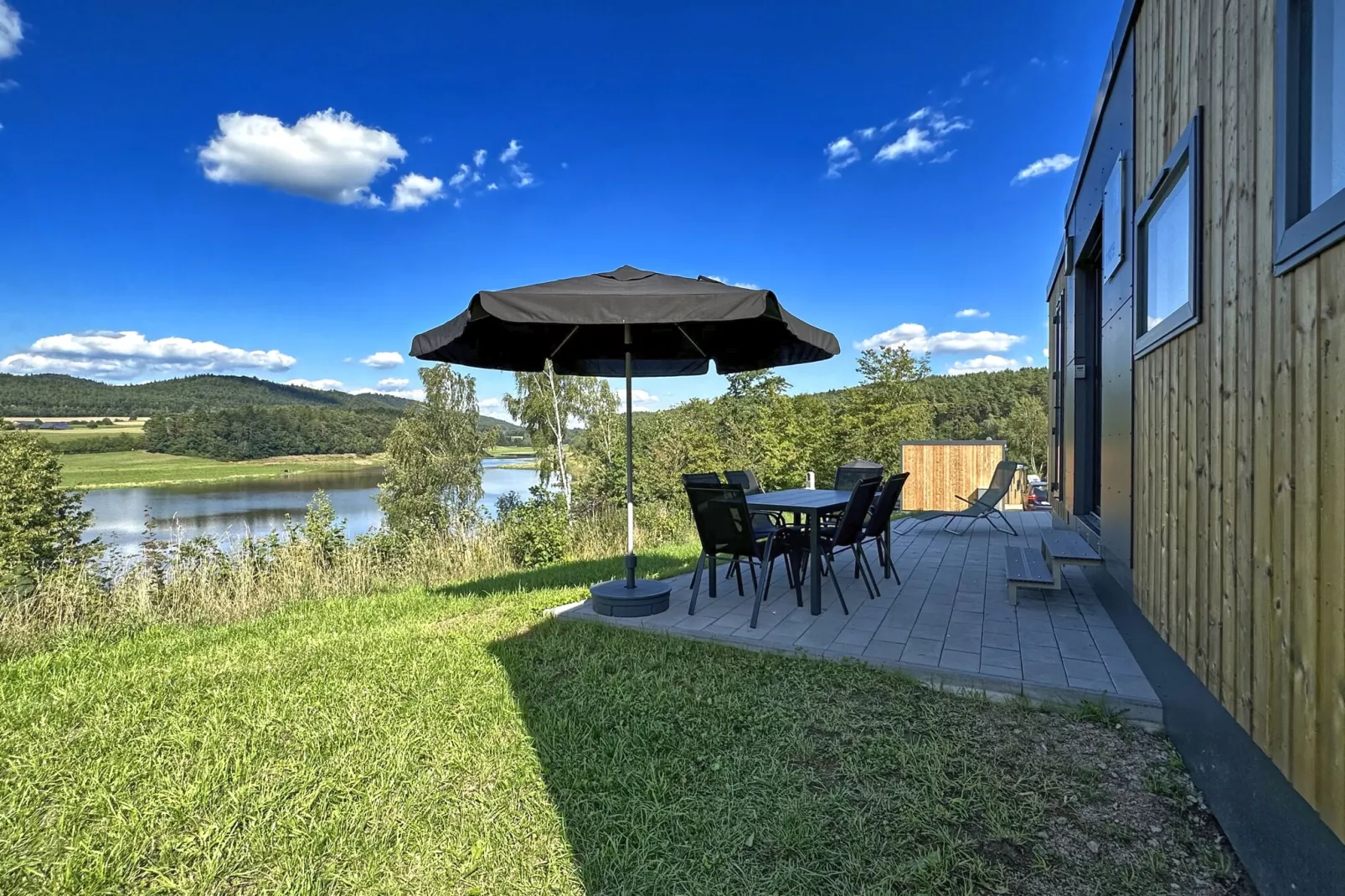 FERIENDORF SEEBLICK - Tiny Chalet am Eixendorfer See-Gardens summer