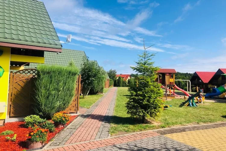 Domki wypoczynkowe - Promyczek - Jardins en été