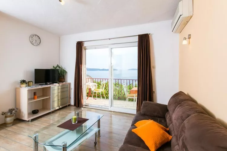 Guest House Fontana - Two Bedroom Apartment with Balcony and Sea View - Wohnzimmer