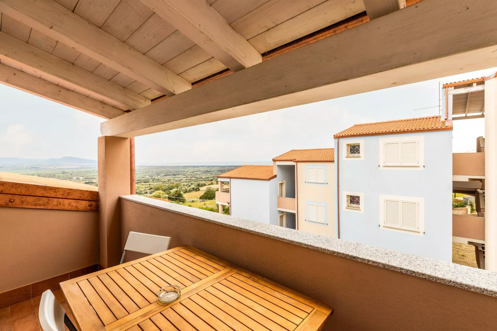 ATTICO BADESI CON PISCINA - Aussicht Sommer