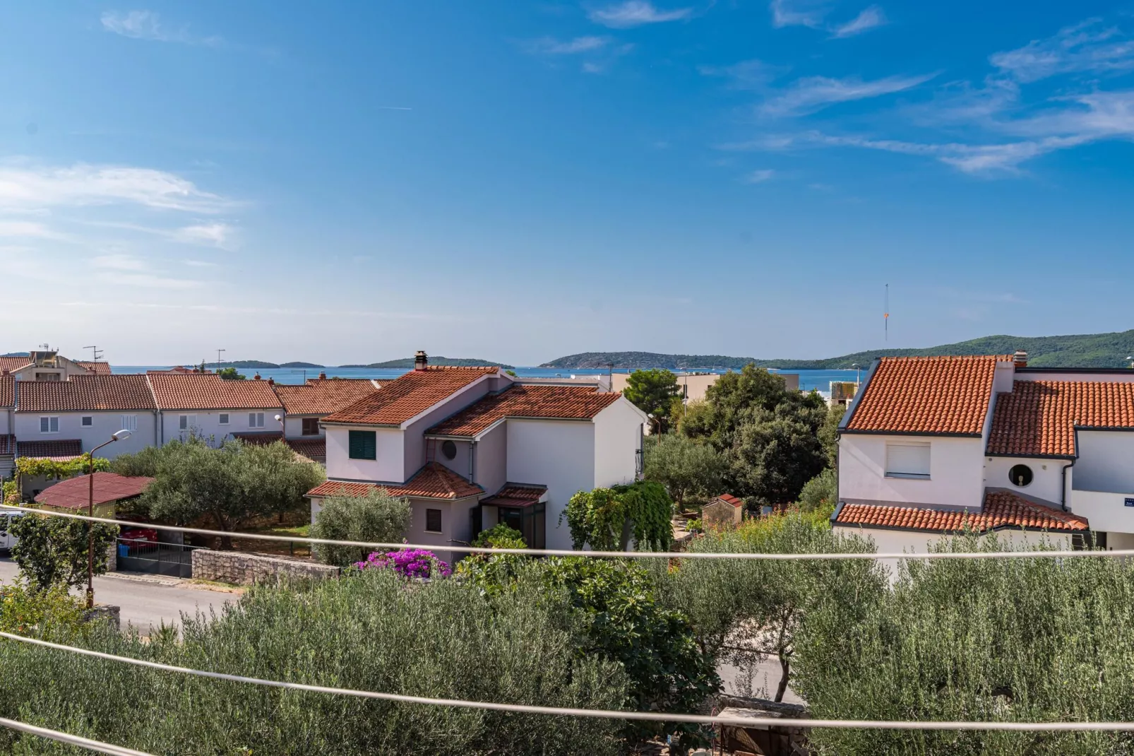 Apartments Bruna - one bedroom apartment A1-View in summer