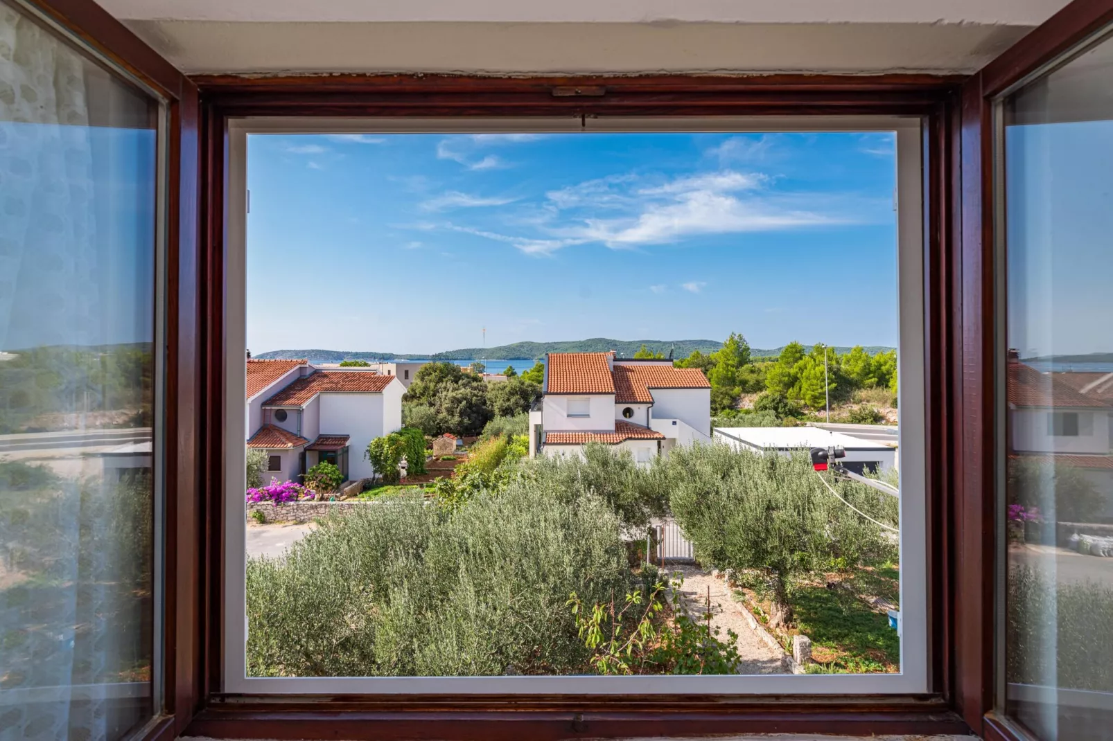 Apartments Bruna - one bedroom apartment A1-View in summer