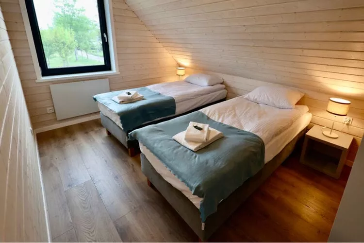 Połowa domu wakacyjnego przy plaży w Stepnicy-Bedroom