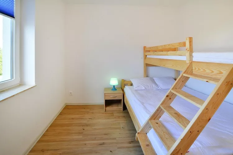 Domy wakacyjne z basenem letnim dla max 4 osób Jarosławiec - Bedroom