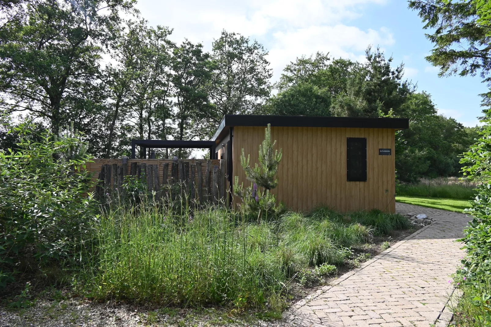 Wellnesslodge Scholekster 4p - Garten Sommer