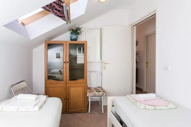 Apartments Tramonto - One Bedroom Apartment with Balcony and Sea View-Bedroom