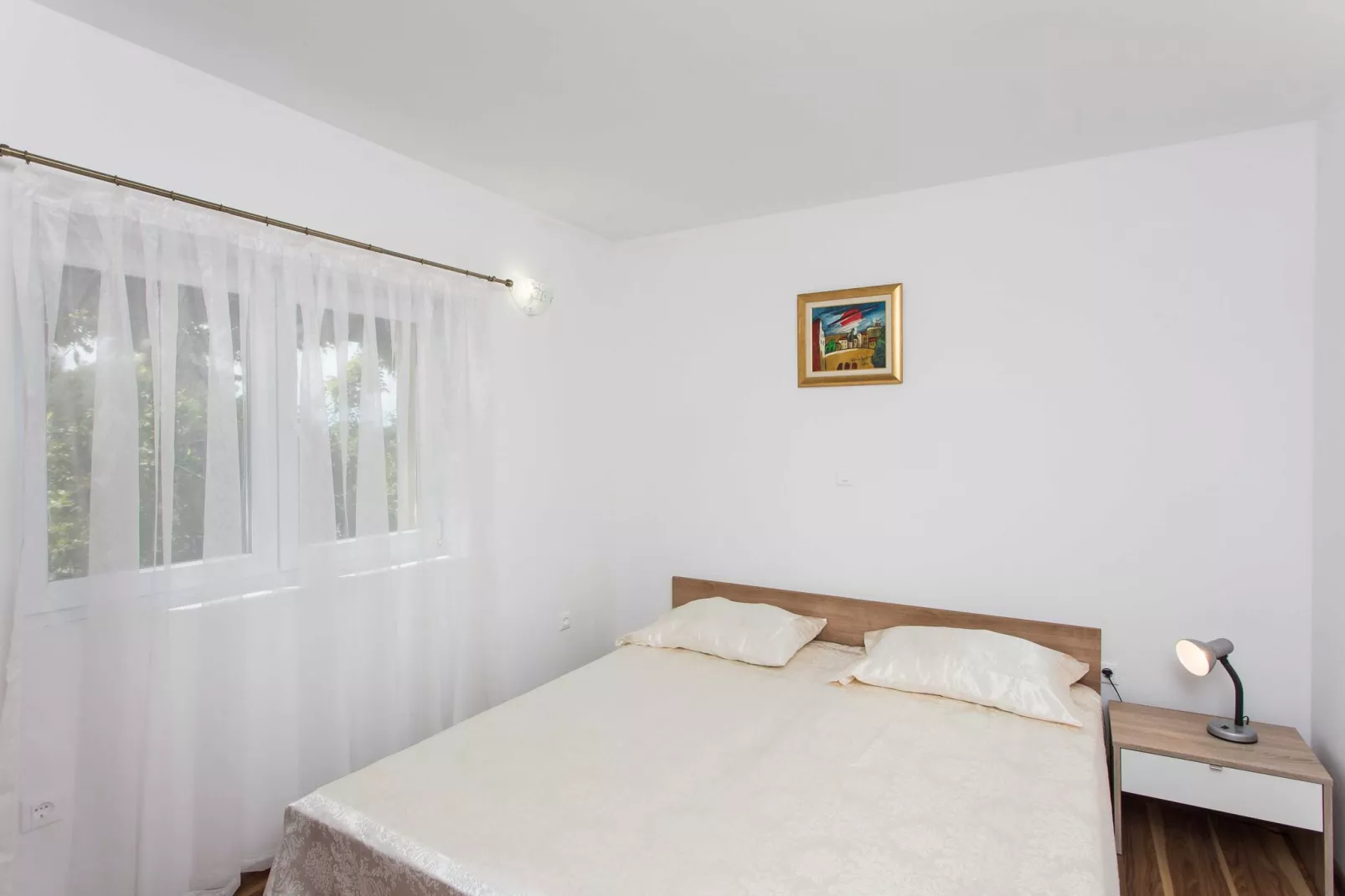 Apartments Djurkovic - One-Bedroom Apartment with Shared Terrace and Sea View-Schlafzimmer