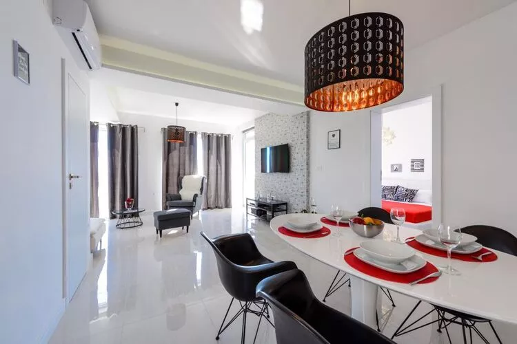 Apartments Villa Capitano - Two Bedroom Apartment with Balcony and Sea View (CRNI)-Dining room