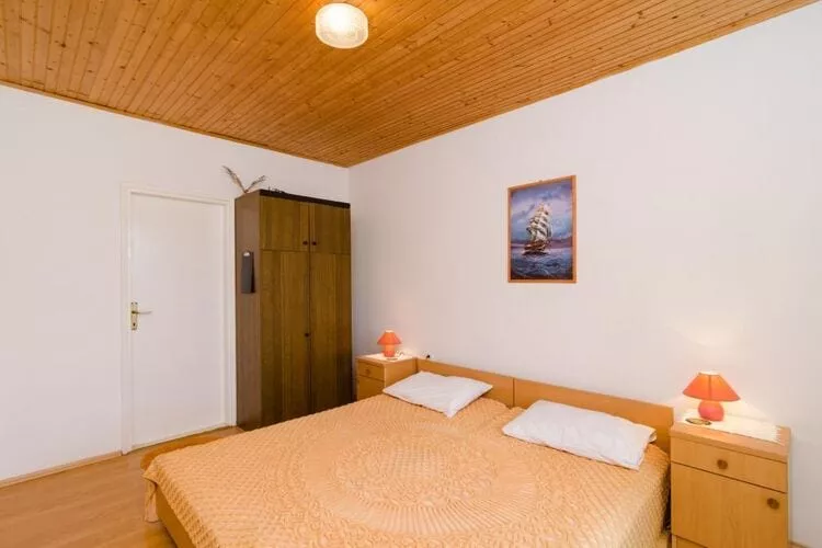 Apartments Sutvid- One Bedroom Apartment with Loggia and Sea View-Bedroom