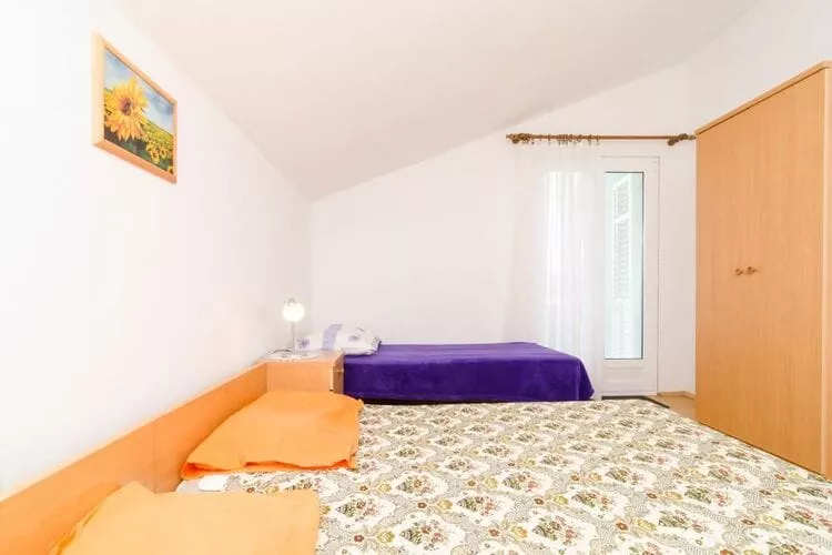 Apartments Sutvid- Comfort One Bedroom Apartment with Loggia and Sea View-Bedroom