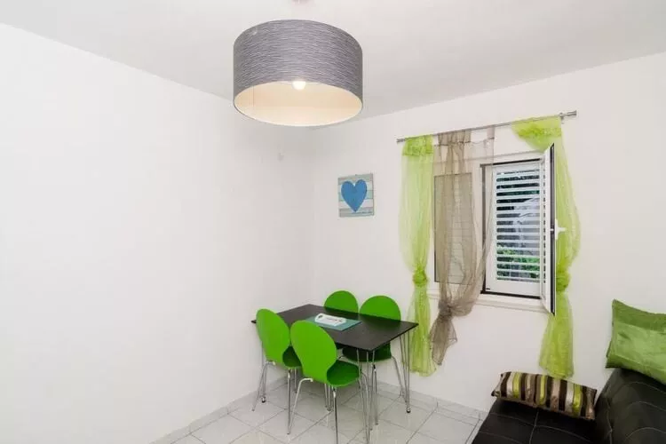 Apartments Ammos - One Bedroom Apartment with Shared Terrace and Sea View (Veliki)-Esszimmer