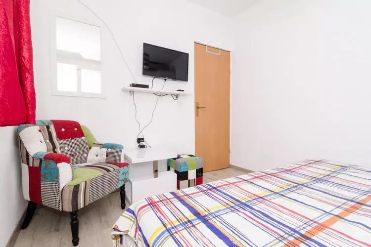 Apartments Ammos - One Bedroom Apartment with Shared Terrace and Sea View (Veliki)-Schlafzimmer