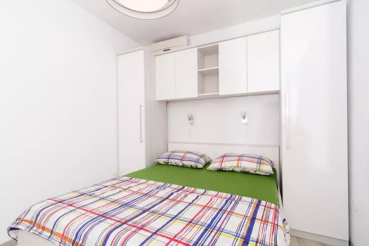 Apartments Ammos - One Bedroom Apartment with Shared Terrace and Sea View (Veliki)-Schlafzimmer