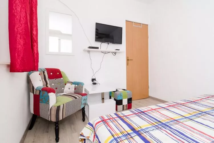 Apartments Ammos - One Bedroom Apartment with Shared Terrace and Sea View (Veliki)-Schlafzimmer