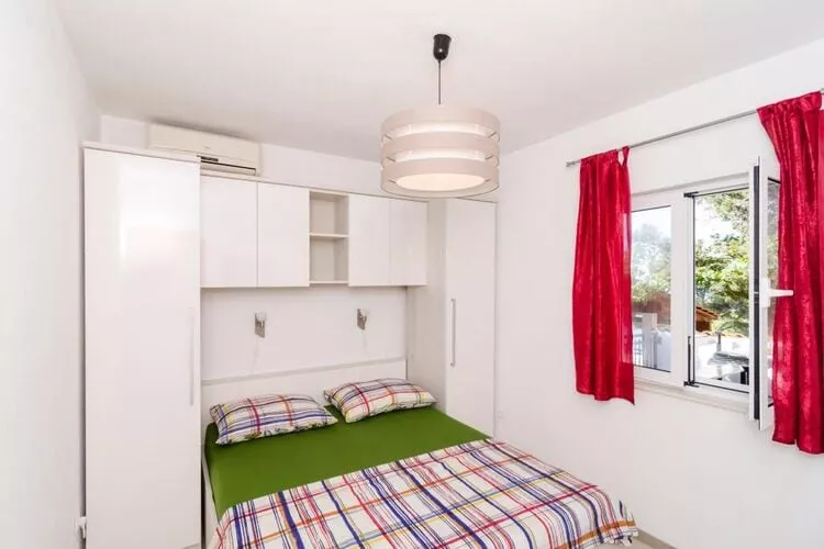 Apartments Ammos - One Bedroom Apartment with Shared Terrace and Sea View (Veliki)-Schlafzimmer