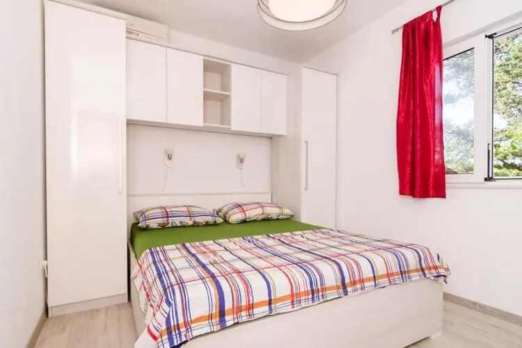 Apartments Ammos - One Bedroom Apartment with Shared Terrace and Sea View (Veliki)-Schlafzimmer