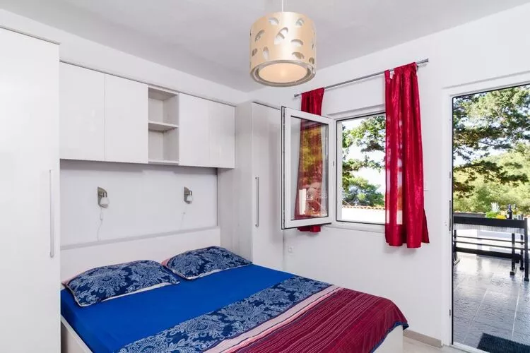 Apartments Ammos - One Bedroom Apartment with Shared Terrace and Sea View (Mali)-Bedroom