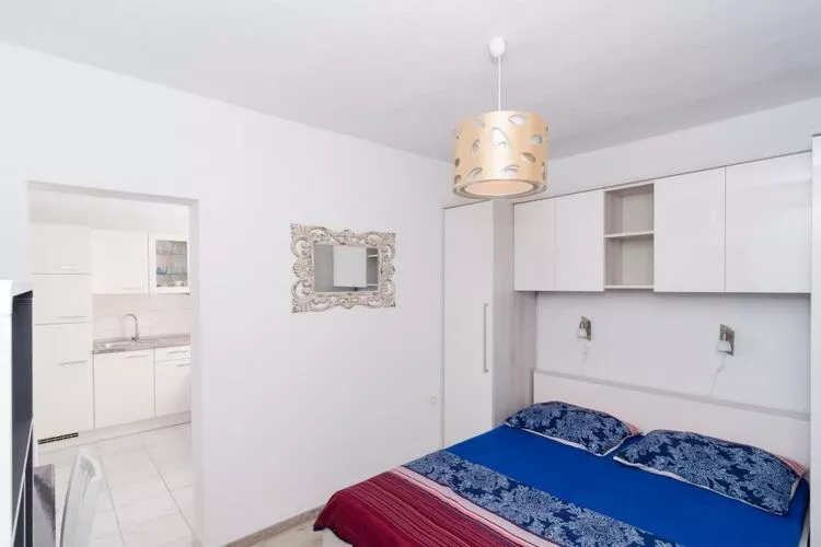 Apartments Ammos - One Bedroom Apartment with Shared Terrace and Sea View (Mali)-Bedroom
