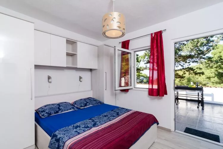 Apartments Ammos - One Bedroom Apartment with Shared Terrace and Sea View (Mali)-Bedroom