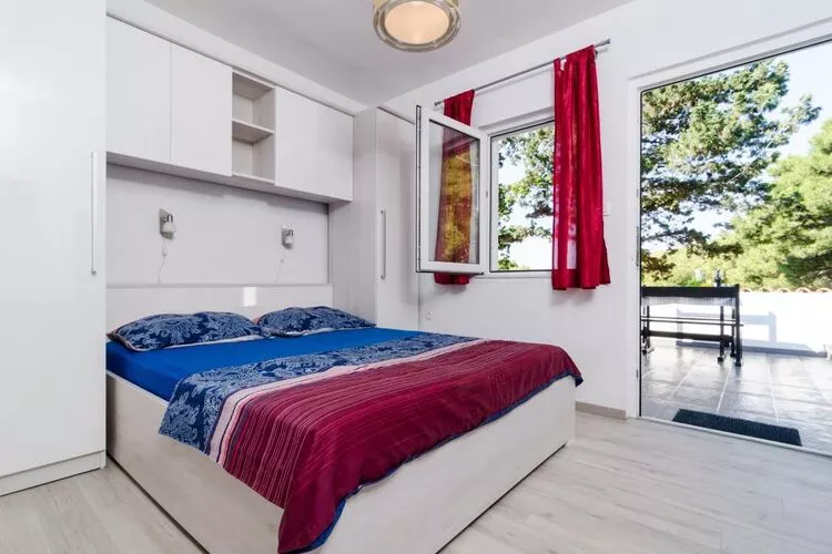 Apartments Ammos - One Bedroom Apartment with Shared Terrace and Sea View (Mali)-Bedroom