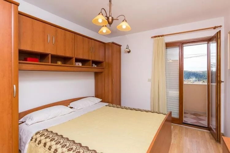 Apartment Jele - Two Bedroom Apartment with Balcony and Garden View-Bedroom