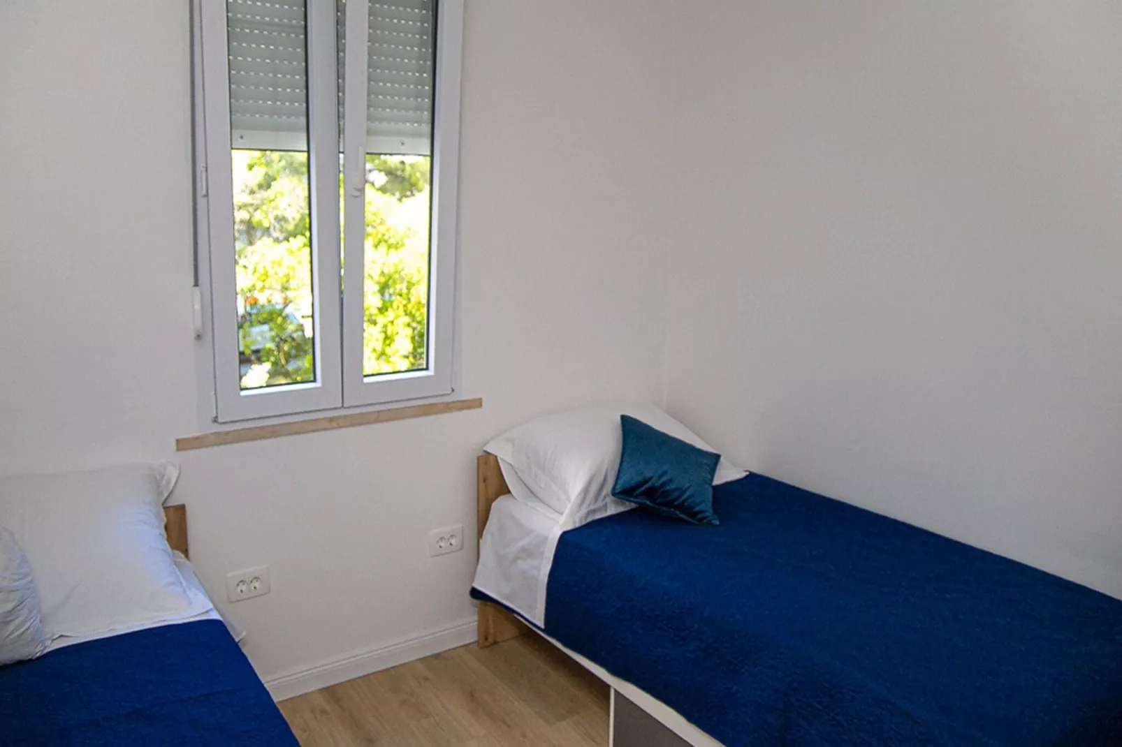 Apartment Matea - Two Bedroom Apartment with Balcony and Sea view-Bedroom