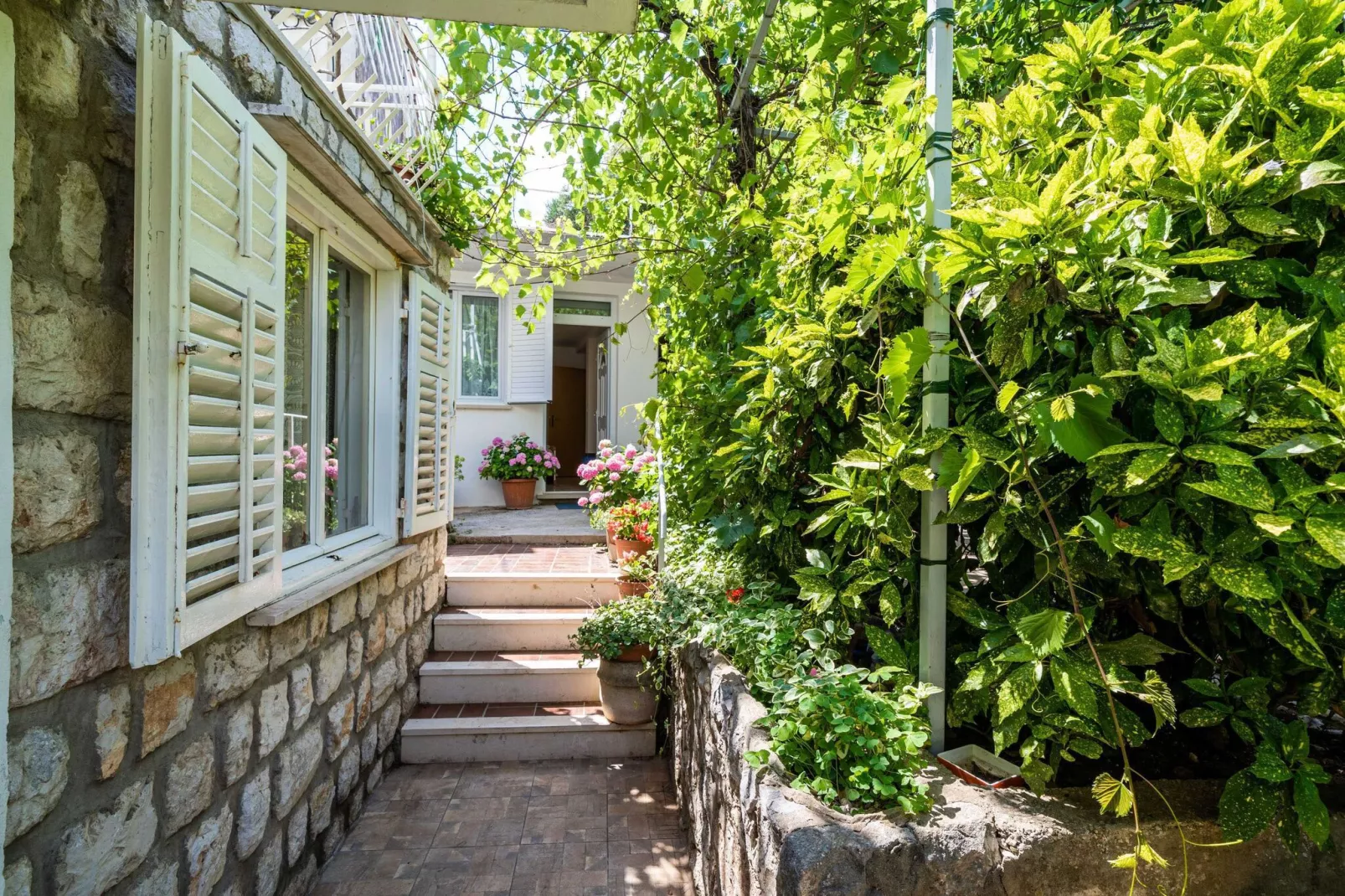 Apartments Zarac - One Bedroom Apartment with Terrace-Gardens summer