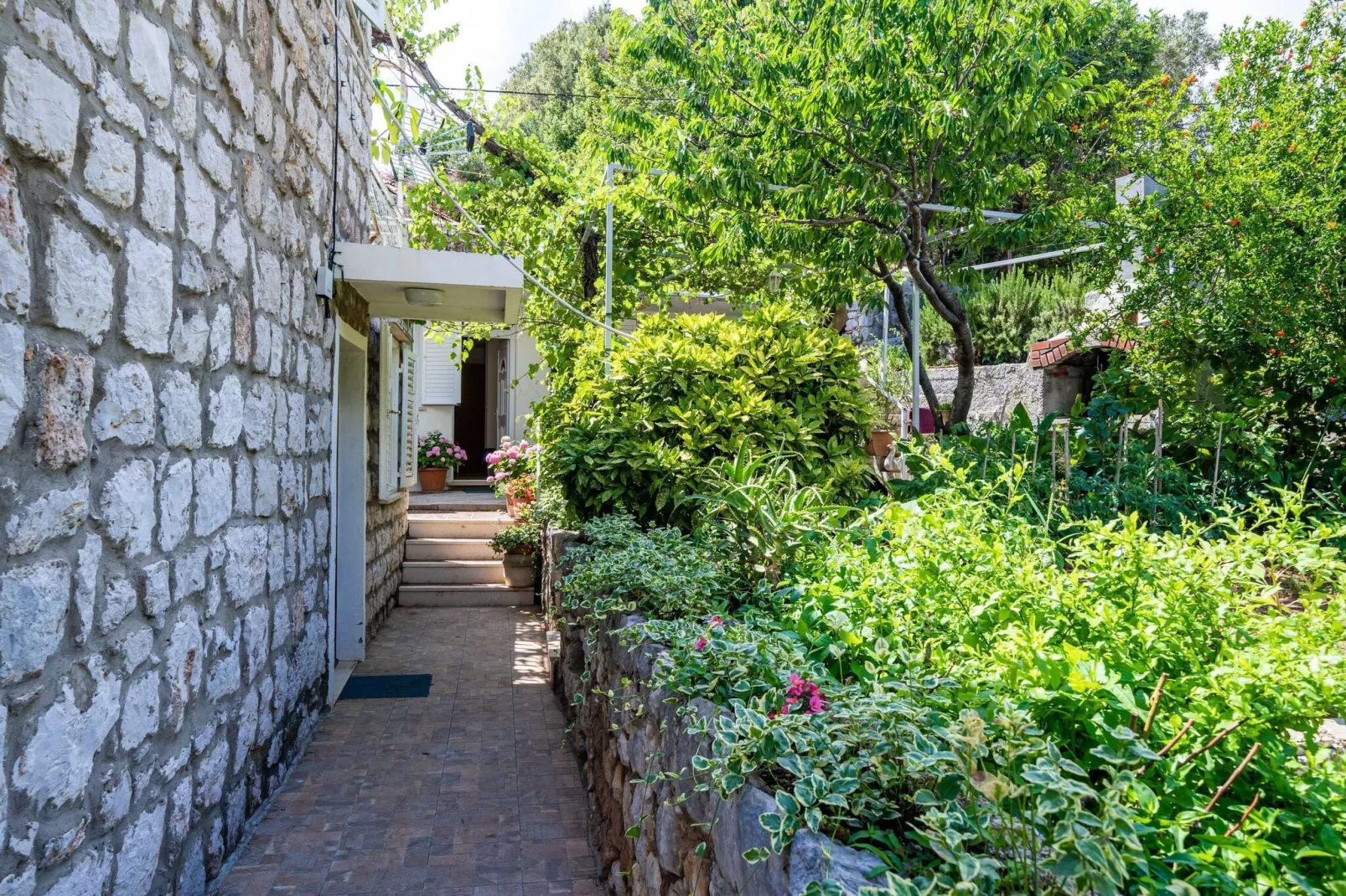 Apartments Zarac - One Bedroom Apartment with Terrace-Gardens summer