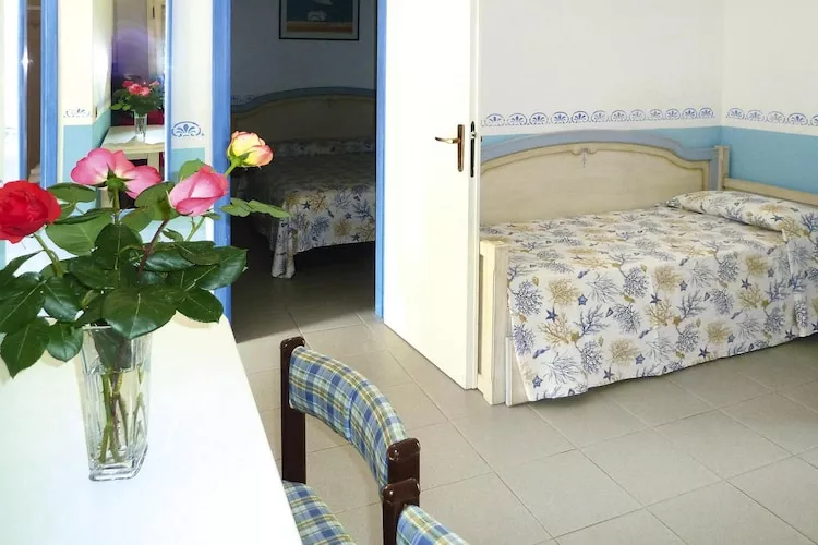 TH Holiday resort Ortano Mare Village & Residence Rio Marina-Bilo 5 Le Ville-1 piano balcone-Bedroom
