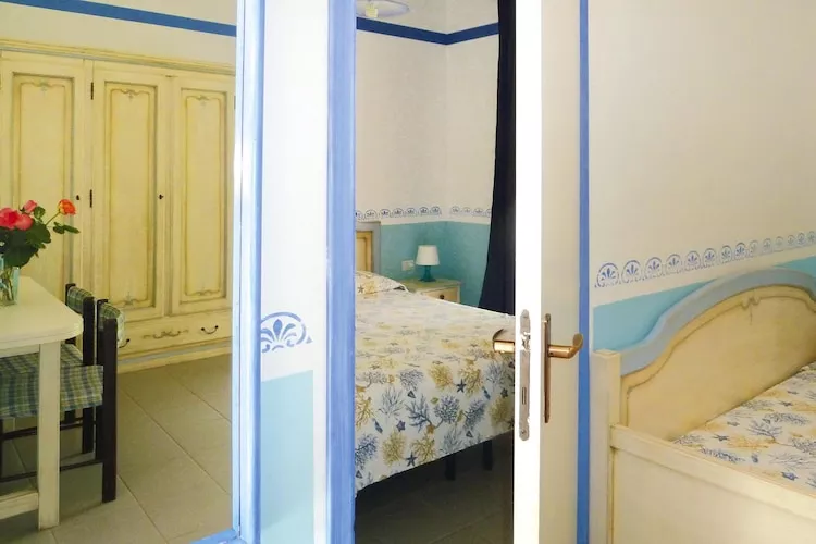 TH Holiday resort Ortano Mare Village & Residence Rio Marina-Bilo 5 Le Ville-1 piano balcone-Bedroom