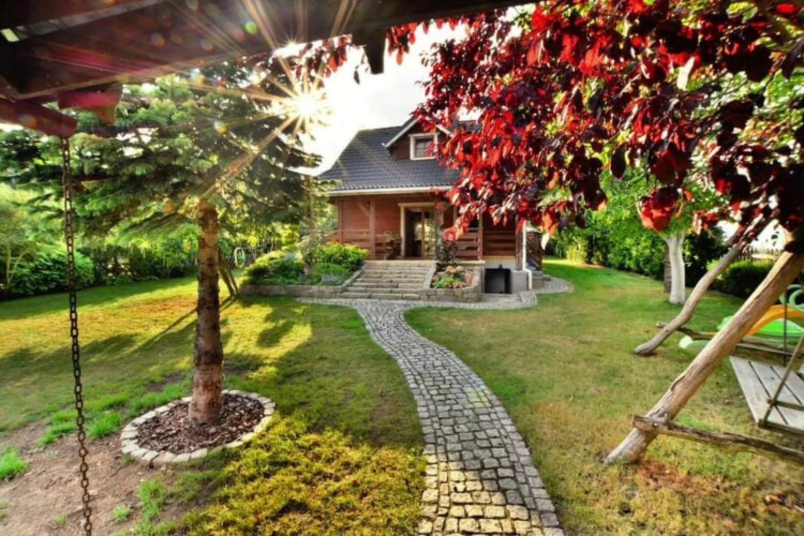 Dom wakacyjny nad jeziorem Oswino-Gardens summer